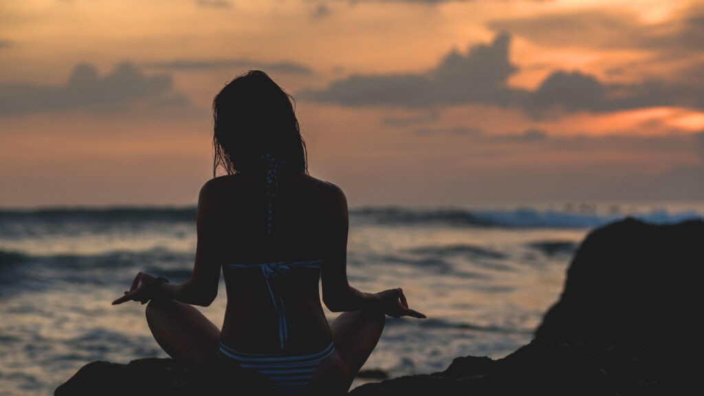 solo traveler in ocean sunset view